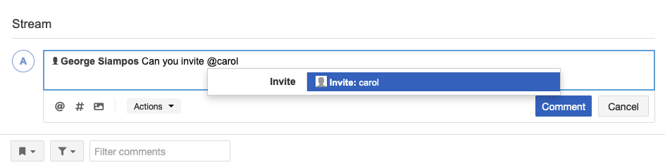 Type @ followed by the user's email address, then select the blue Invite bar that appears.